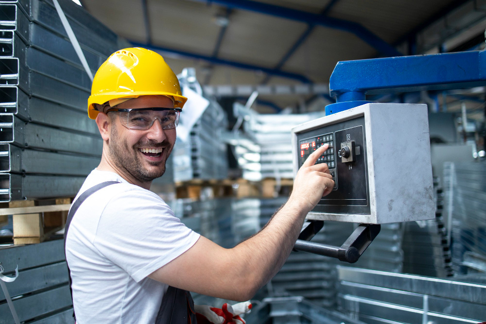 portrait-factory-worker-operating-industrial-machine-setting-parameters-computer